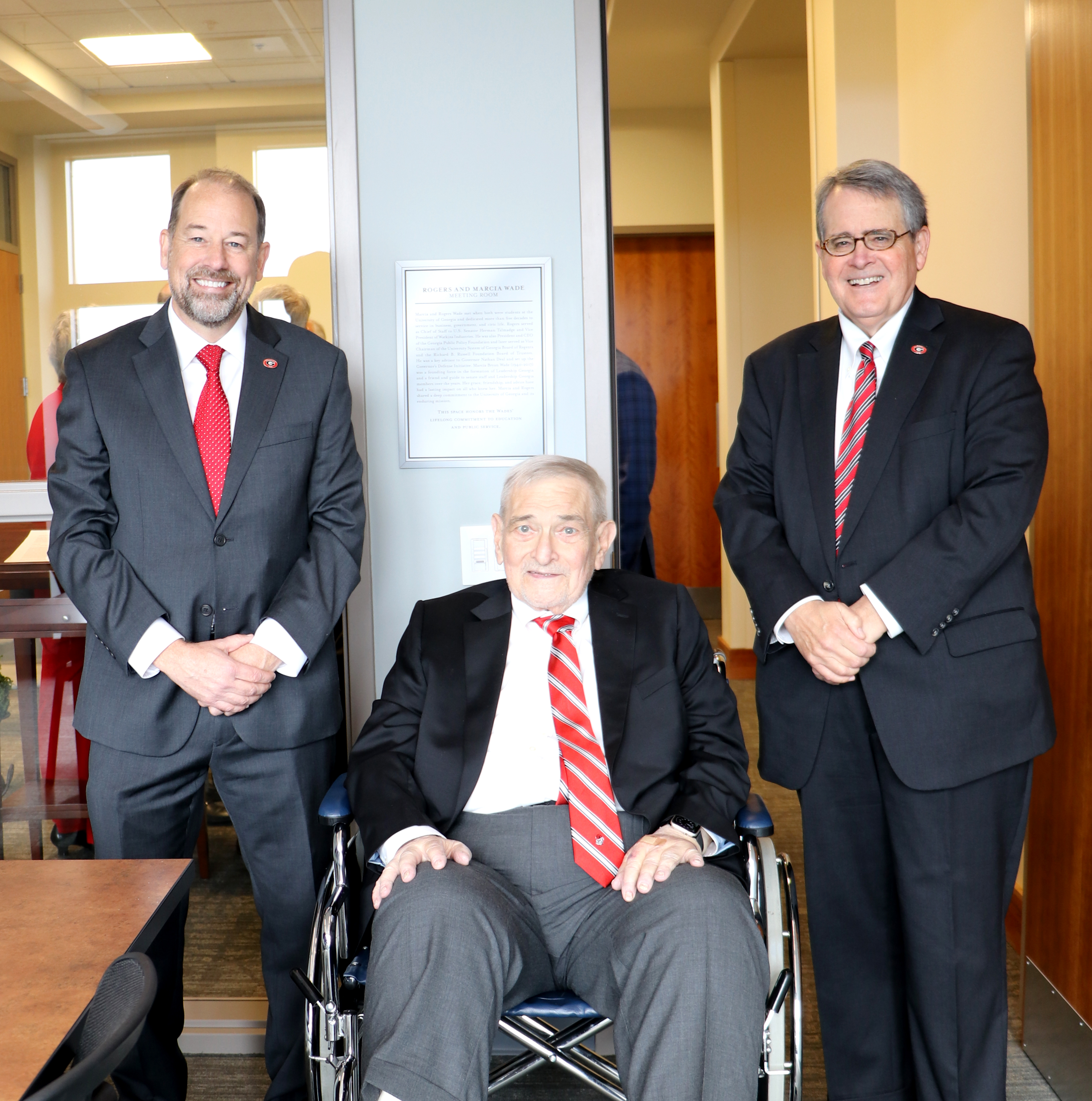 University Librarian Toby Graham (left) and UGA President Jere W. Morehead (right) pose with T. Rogers Wade in front of a plaque commemorating the naming of the Rogers and Marcia Wade Meeting Room at the Richard B. Russell Building Special Collections Libraries. (Photo by Camie Williams)