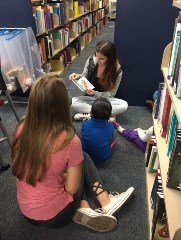 COE students reading to preschoolers in the CML Fall 2016