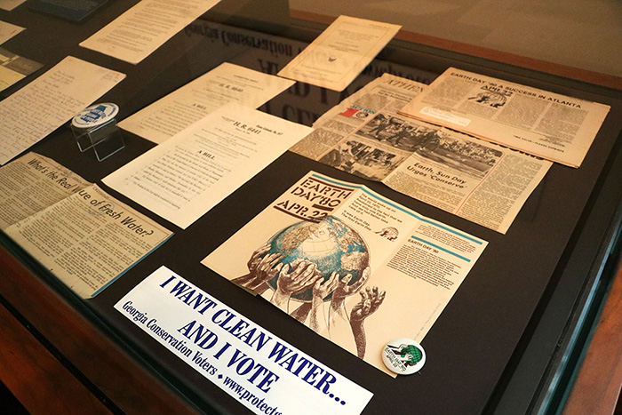 Exhibit case with news clippings related to the fight for drinkable water