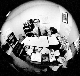 Moore at his desk when working for Nixon