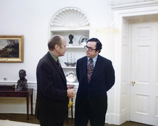 Moore standing with Gerald Ford in the Oval Office