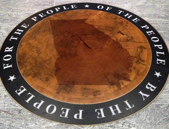 “The Stump,” an icon of American representative democracy, graces the McMullen Foyer floor in the Russell Gallery. 